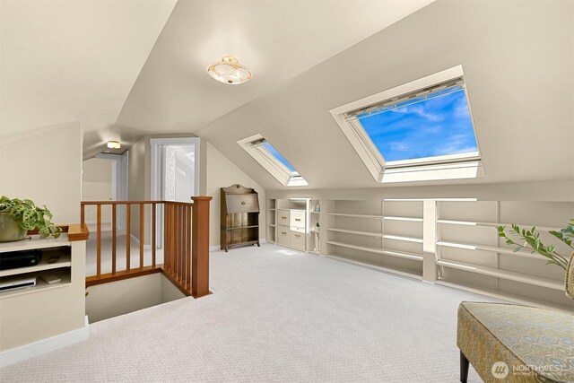 1800 Dakin St, Bellingham, WA 98229 - additional living space with carpet, a skylight, lofted ceiling, and built in shelves