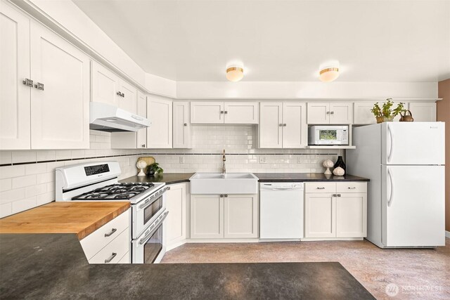 1800 Dakin St, Bellingham, WA 98229 - kitchen featuring white appliances, under cabinet range hood, white cabinets, and decorative backsplash