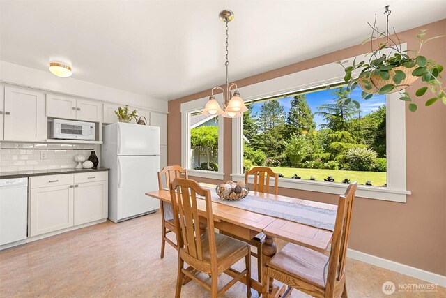 1800 Dakin St, Bellingham, WA 98229 - dining space with a chandelier and healthy amount of natural light