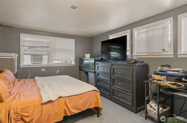 229 N Garfield Ave, Wenatchee, WA 98801 - bedroom with light carpet, multiple windows, and cooling unit