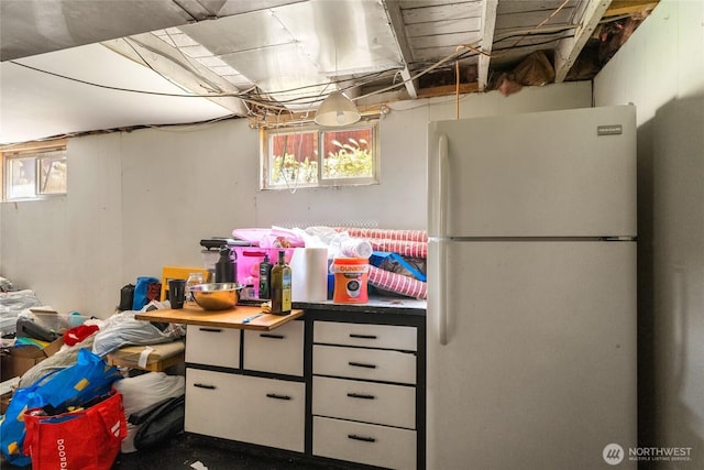 229 N Garfield Ave, Wenatchee, WA 98801 - basement featuring freestanding refrigerator and plenty of natural light