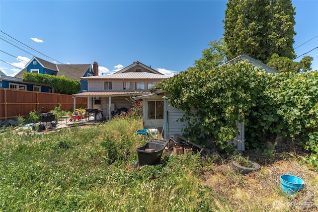 229 N Garfield Ave, Wenatchee, WA 98801 - back of house featuring a patio area and a chimney