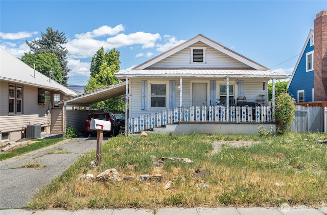 229 N Garfield Ave, Wenatchee, WA 98801 - bungalow-style home with a porch, asphalt driveway, and an attached carport