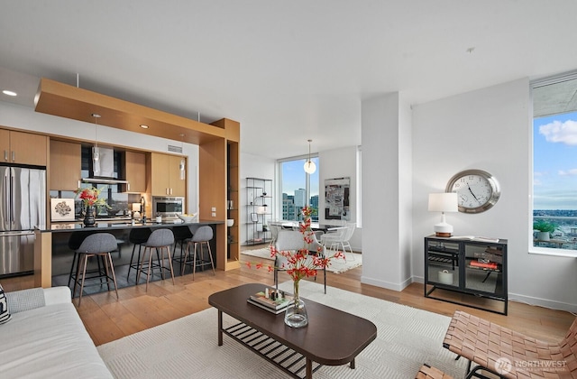 1321 Seneca St Unit 1001, Seattle, WA 98101 - living room featuring light wood-style flooring and recessed lighting