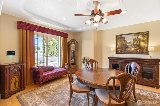 7322 NE Blue Goose Rd, Moses Lake, WA 98837 - dining area featuring light wood-style floors, ceiling fan, recessed lighting, and a raised ceiling