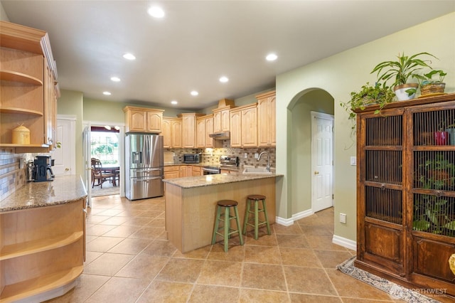 7322 NE Blue Goose Rd, Moses Lake, WA 98837 - kitchen featuring open shelves, appliances with stainless steel finishes, a peninsula, light brown cabinetry, and recessed lighting