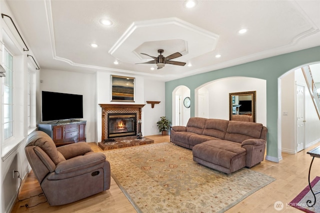 7322 NE Blue Goose Rd, Moses Lake, WA 98837 - living room with arched walkways, a raised ceiling, ceiling fan, and recessed lighting
