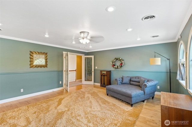 7322 NE Blue Goose Rd, Moses Lake, WA 98837 - sitting room with ornamental molding, wood finished floors, a ceiling fan, and recessed lighting
