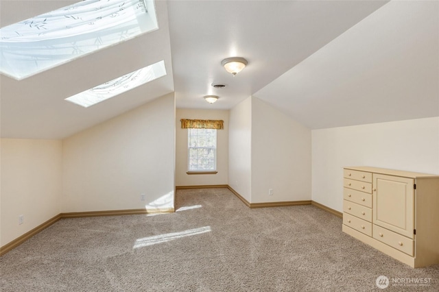 7322 NE Blue Goose Rd, Moses Lake, WA 98837 - additional living space with a skylight, light carpet, and vaulted ceiling
