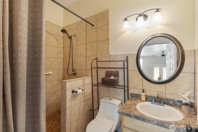 7322 NE Blue Goose Rd, Moses Lake, WA 98837 - bathroom featuring tile walls, a tile shower, vanity, and a ceiling fan