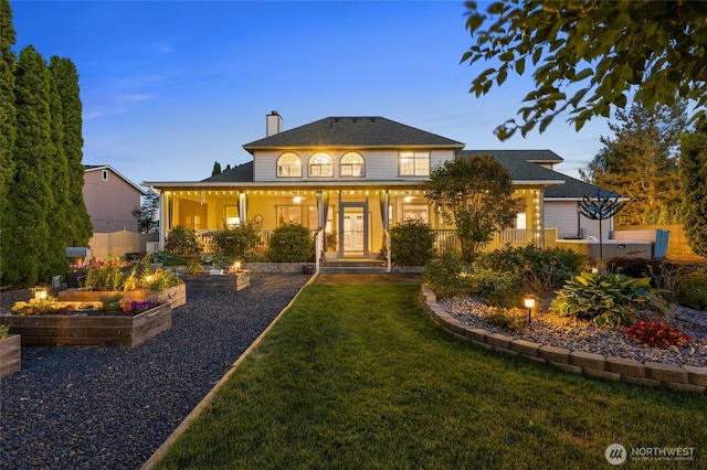 7322 NE Blue Goose Rd, Moses Lake, WA 98837 - view of front of property featuring a garden, a front yard, and a chimney
