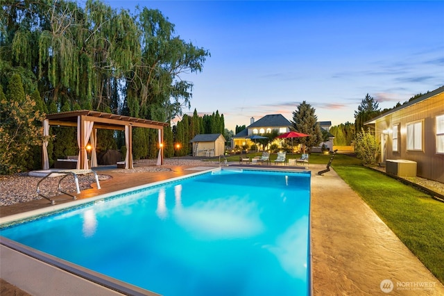 7322 NE Blue Goose Rd, Moses Lake, WA 98837 - swimming pool featuring a patio, a shed, and a lawn