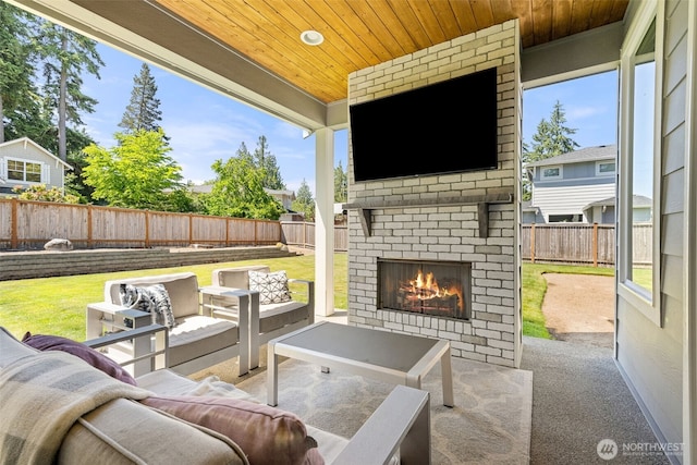 8704 188th St SW, Edmonds, WA 98026 - fenced backyard featuring a patio and an outdoor living space with a fireplace