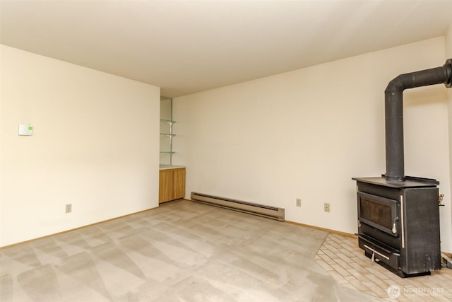 25735 115th St SE Unit B102, Kent, WA 98030 - unfurnished living room with a baseboard heating unit, a wood stove, and carpet floors