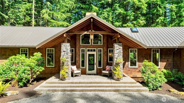 36915 NE 98th St, Carnation, WA 98014 - entrance to property featuring crawl space, a metal roof, a chimney, and stone siding