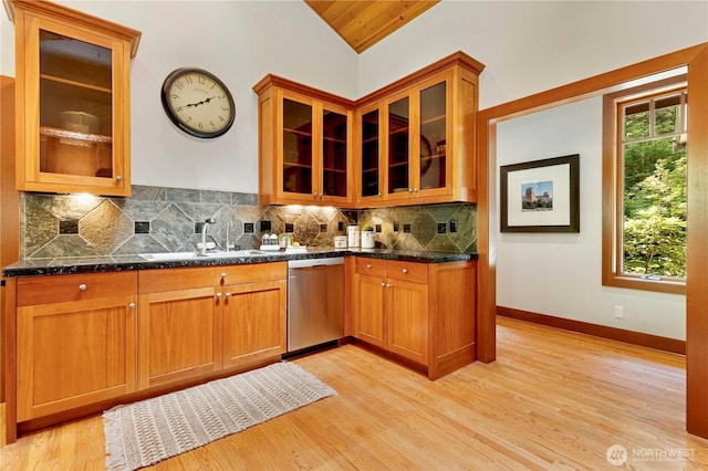 36915 NE 98th St, Carnation, WA 98014 - kitchen with dishwasher, tasteful backsplash, light wood-type flooring, glass insert cabinets, and vaulted ceiling
