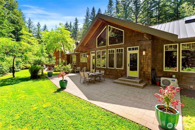 36915 NE 98th St, Carnation, WA 98014 - rear view of property with a standing seam roof, a patio area, a lawn, and a metal roof