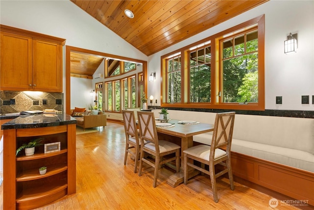 36915 NE 98th St, Carnation, WA 98014 - dining area with wooden ceiling, a wainscoted wall, vaulted ceiling, and light wood-style flooring