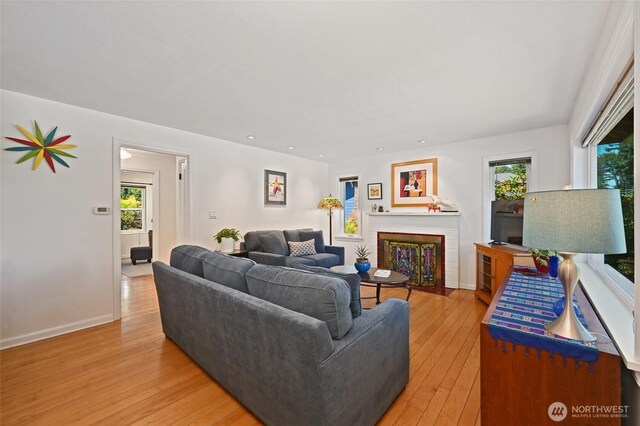 9539 49th Ave NE, Seattle, WA 98115 - living room with light wood finished floors, a brick fireplace, and recessed lighting