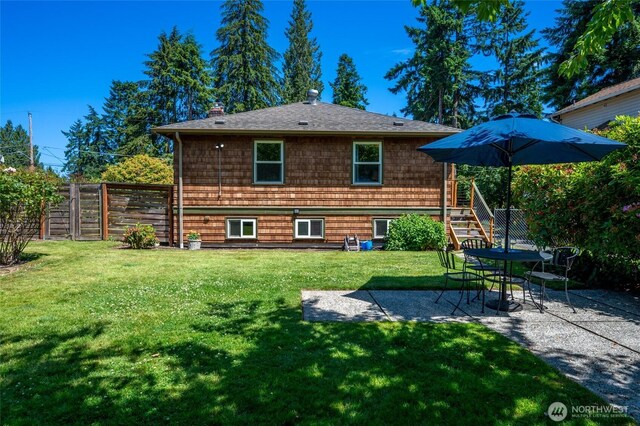 9539 49th Ave NE, Seattle, WA 98115 - rear view of house featuring a patio, roof with shingles, and a chimney