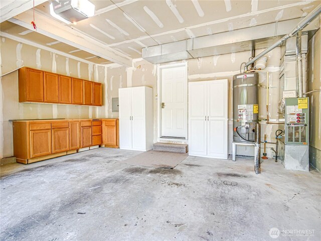 18808 19th Dr SE, Bothell, WA 98012 - garage featuring strapped water heater, a garage door opener, and electric panel