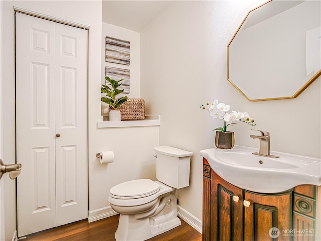 18808 19th Dr SE, Bothell, WA 98012 - half bathroom with wood finished floors, vanity, and a closet