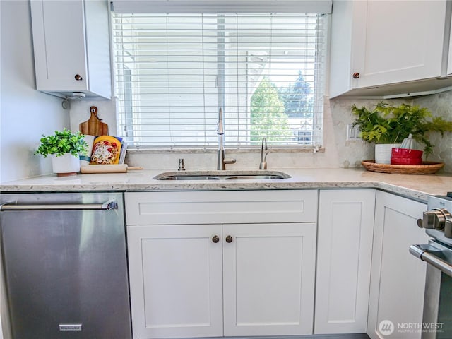 18808 19th Dr SE, Bothell, WA 98012 - kitchen featuring appliances with stainless steel finishes, white cabinets, backsplash, and light stone countertops
