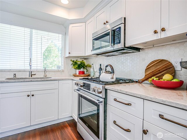 18808 19th Dr SE, Bothell, WA 98012 - kitchen with stainless steel appliances, white cabinets, dark wood-style floors, and light stone counters