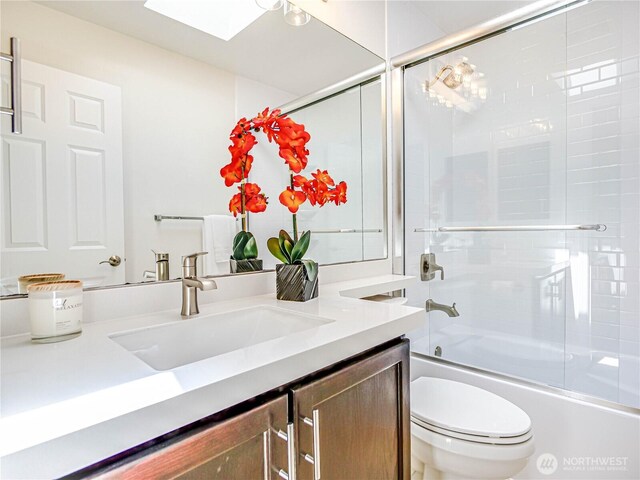 18808 19th Dr SE, Bothell, WA 98012 - bathroom featuring vanity, a skylight, and combined bath / shower with glass door