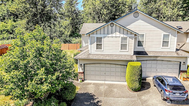 18808 19th Dr SE, Bothell, WA 98012 - view of front of property with a shingled roof, board and batten siding, driveway, a garage, and brick siding