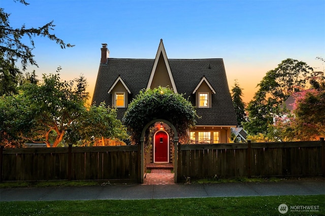 251 N Garden St, Bellingham, WA 98225 - tudor house with a fenced front yard, a chimney, and a shingled roof