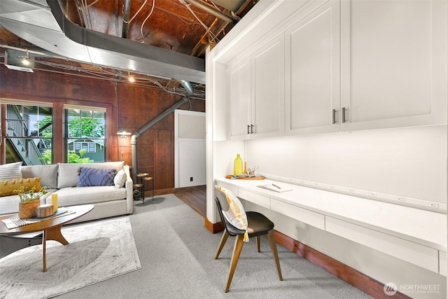 251 N Garden St, Bellingham, WA 98225 - living area featuring carpet floors, wooden walls, and a desk