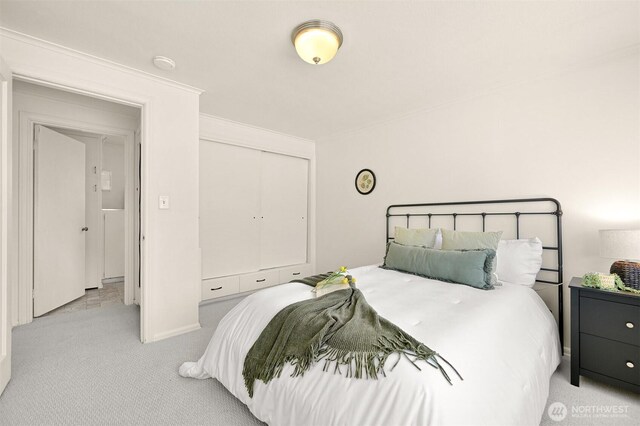 251 N Garden St, Bellingham, WA 98225 - carpeted bedroom with a closet and ornamental molding