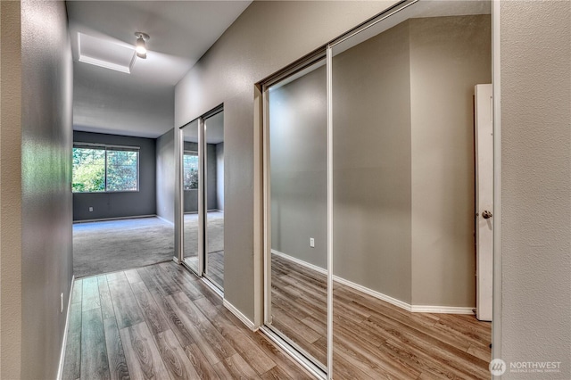 14413 Riverwalk Dr, Sumner, WA 98390 - corridor with wood finished floors and baseboards