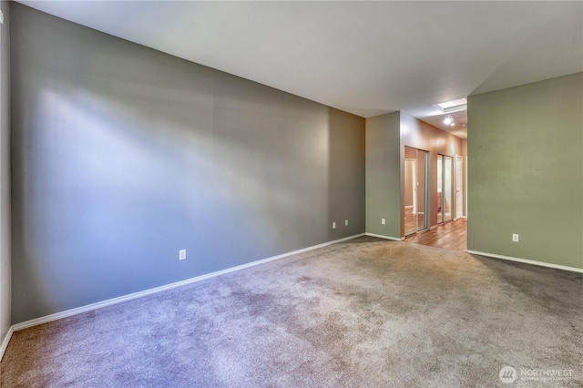 14413 Riverwalk Dr, Sumner, WA 98390 - unfurnished room featuring carpet flooring and baseboards
