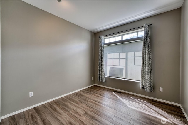 14413 Riverwalk Dr, Sumner, WA 98390 - empty room with wood finished floors and baseboards