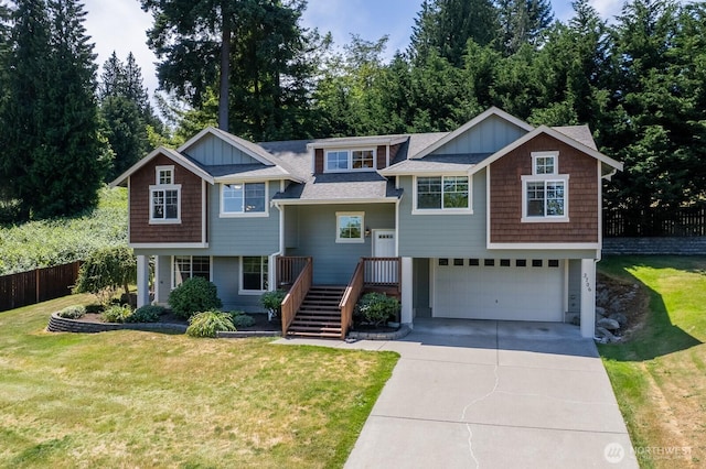 3706 54th St E, Tacoma, WA 98443 - view of front of house with an attached garage, concrete driveway, roof with shingles, and board and batten siding