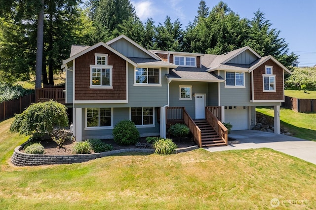 3706 54th St E, Tacoma, WA 98443 - view of front facade with concrete driveway, an attached garage, board and batten siding, and a shingled roof