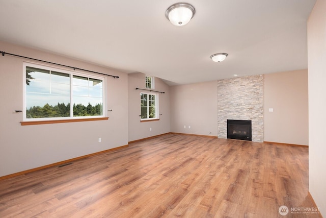 3706 54th St E, Tacoma, WA 98443 - unfurnished living room with light wood finished floors and a fireplace