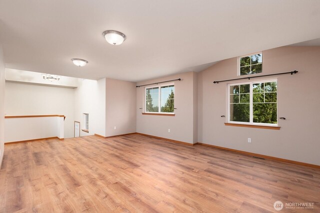 3706 54th St E, Tacoma, WA 98443 - spare room with light wood-type flooring and lofted ceiling