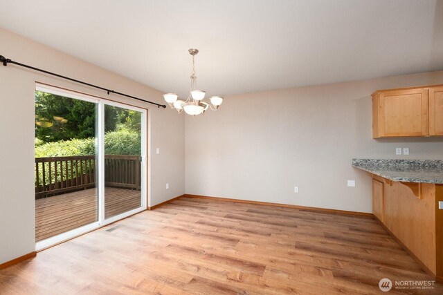 3706 54th St E, Tacoma, WA 98443 - unfurnished dining area featuring a chandelier and light wood-type flooring