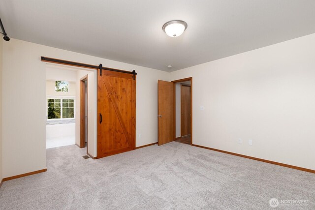 3706 54th St E, Tacoma, WA 98443 - unfurnished bedroom featuring baseboards and carpet