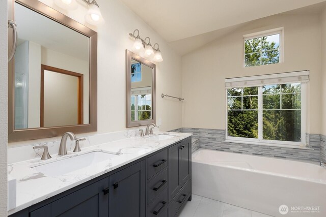 3706 54th St E, Tacoma, WA 98443 - bathroom featuring double vanity, a garden tub, and lofted ceiling