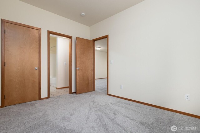 3706 54th St E, Tacoma, WA 98443 - unfurnished bedroom featuring light colored carpet and baseboards