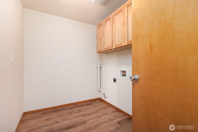 3706 54th St E, Tacoma, WA 98443 - washroom featuring hookup for an electric dryer, hookup for a washing machine, cabinet space, light wood-style flooring, and gas dryer hookup