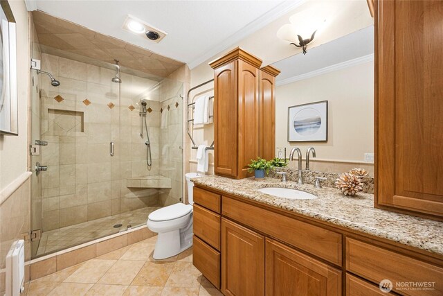 826 Lake St S, Kirkland, WA 98033 - full bathroom with ornamental molding, vanity, a shower stall, and tile patterned flooring