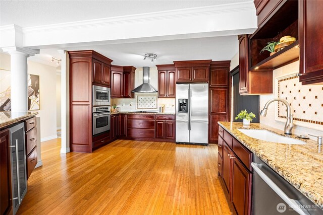 826 Lake St S, Kirkland, WA 98033 - kitchen with stainless steel appliances, dark brown cabinets, wall chimney range hood, decorative backsplash, and beverage cooler