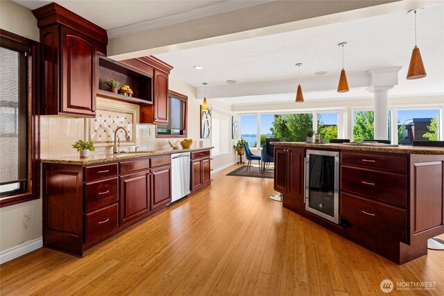826 Lake St S, Kirkland, WA 98033 - kitchen with beverage cooler, dishwasher, dark brown cabinets, light wood-style flooring, and ornamental molding