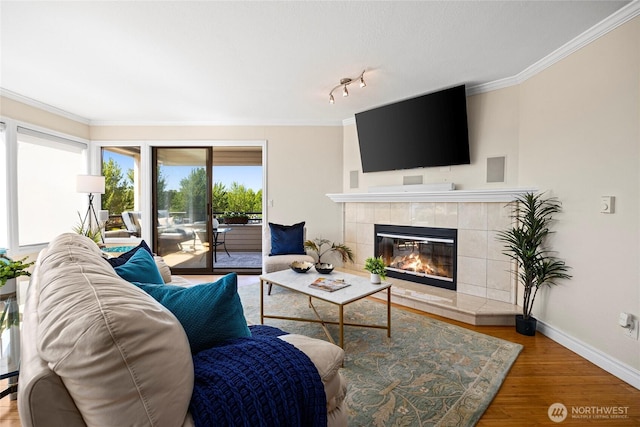 826 Lake St S, Kirkland, WA 98033 - living area featuring a fireplace, wood finished floors, and crown molding
