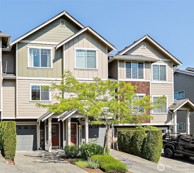 3031 Belmonte Ln, Everett, WA 98201 - view of property with a garage, driveway, and board and batten siding